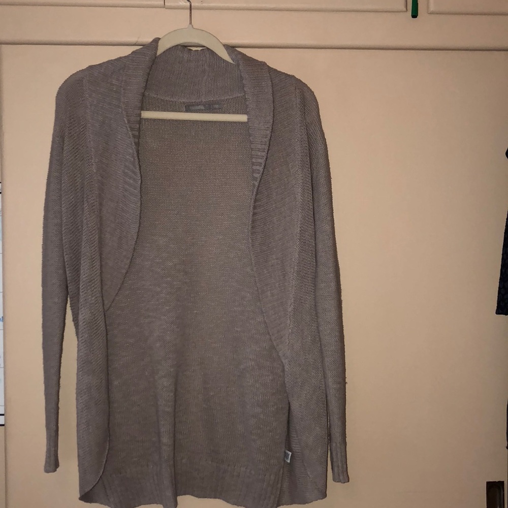 Tan colored long cardigan, goes to upper thigh